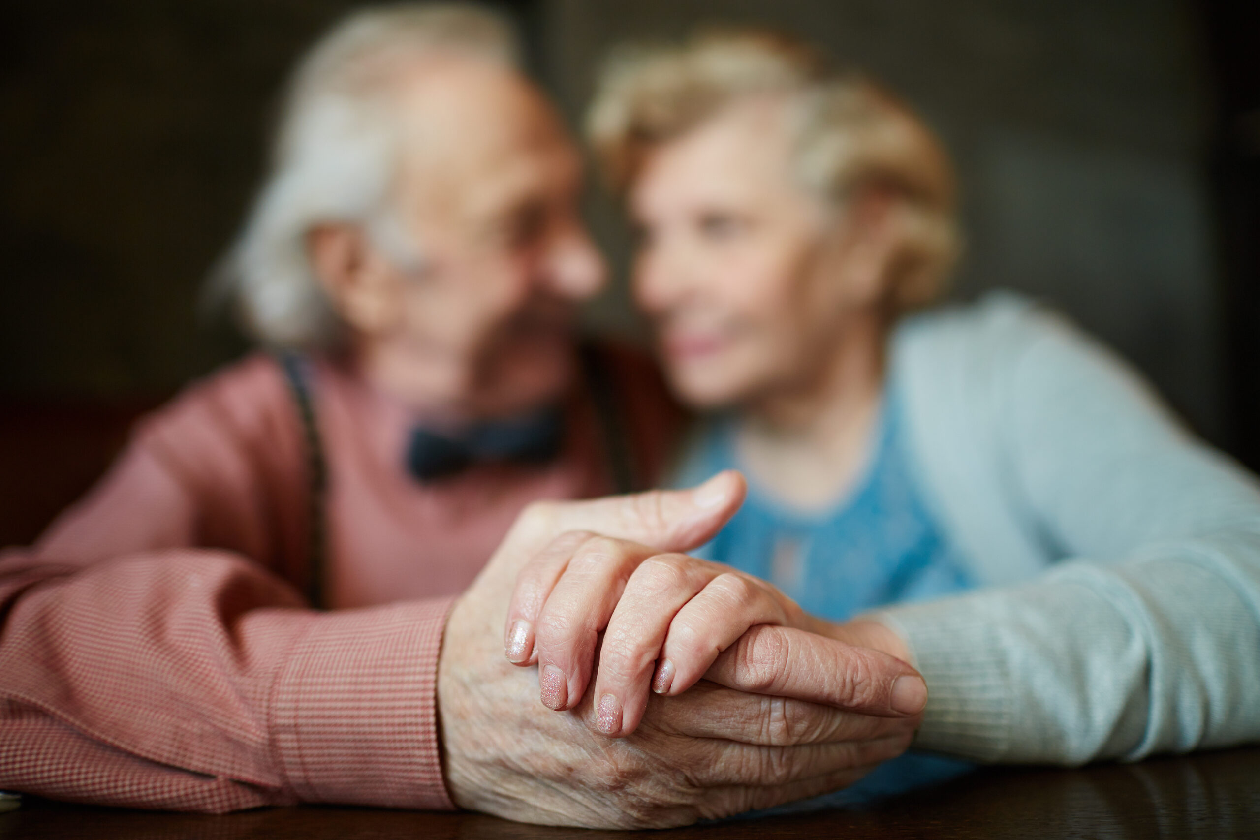 Elderly Couple Holding Hands